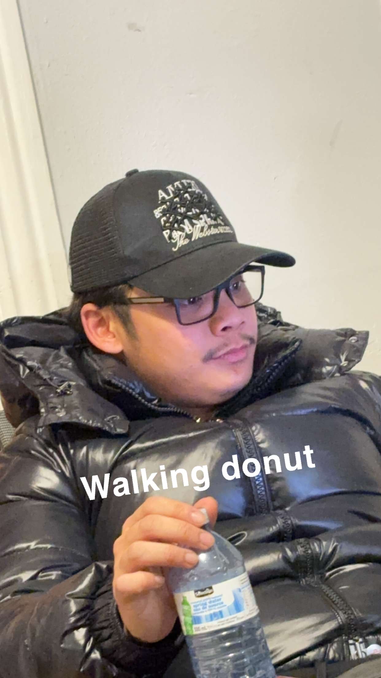 William Don Bautista wearing a cap and glasses